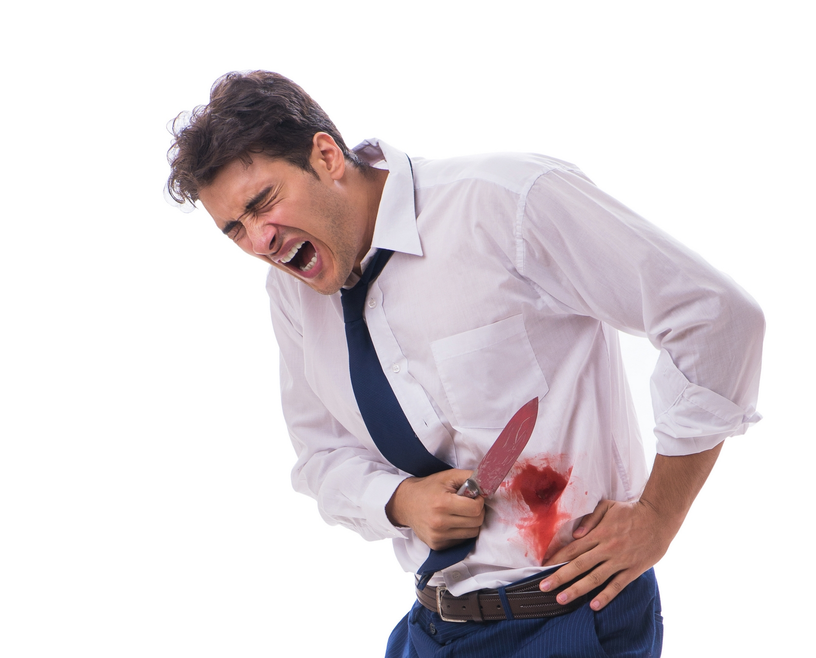 A stock photo of a man with a knife and fake blood on his abdomen, implying he has stabbed himself.